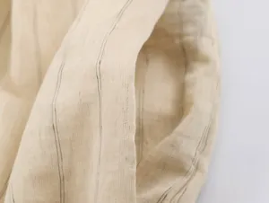 Close-up fabric detail of stylish vertical striped apparel showcasing fine texture.