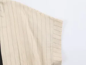Close-up detail of women's new Chinese style striped top fabric, showing fine texture and cuff.