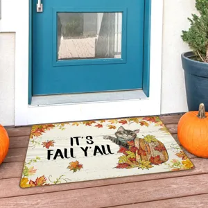 Autumn cat doormat scene detail, cozy porch entrance floor mat with fall leaves and pumpkin decor.