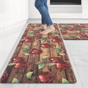 Kitchen mat set detail featuring rustic wood grain and red apple pattern for home decor.