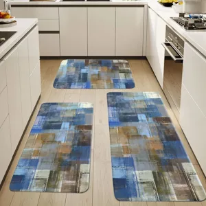 Kitchen rug set detail view showcasing abstract blue geometric pattern on clean floor.