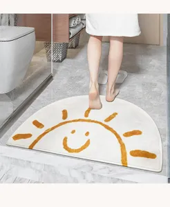 Close-up detail of the half-circle fluffy sunshine floor mat in a cozy bathroom setting.