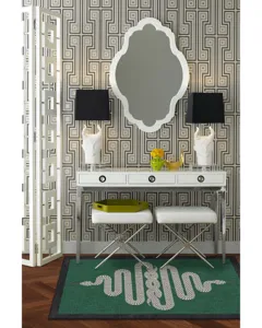 Alfombra retro verde con un llamativo patrón de serpiente geométrica, detalle.
