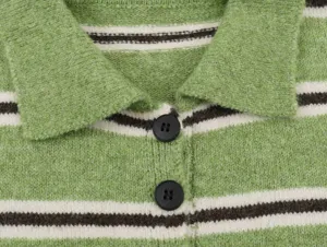 Close-up detail of the green striped knit polo collar sweater showcasing texture.
