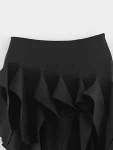 Black irregular ruffle skirt detail view, elegant drape and stylish design for women.