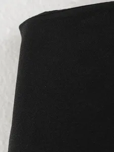 Black skirt fabric detail texture close-up, premium drape material macro view showcase.