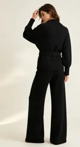 Women black knit sweater and wide leg pants set with belt casual chic outfit detail view