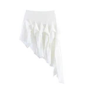 Detailed view of white asymmetrical ruffle skirt, elegant drape design for women fashion.