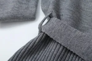 Grey knit suit detail showing fine ribbed texture and matching belt loop for women fashion