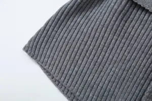 Grey ribbed knit fabric detail, comfortable and stylish casual texture for women apparel.