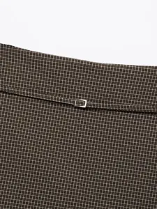 Brown houndstooth plaid mini skirt with metallic buckle detail, autumn chic women's apparel.