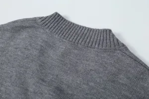 Gray knit sweater collar detail close-up showing soft ribbed texture and fine craftsmanship.