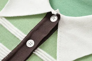 Close-up of women's color-block striped Polo collar knitwear showcasing soft texture and buttons.
