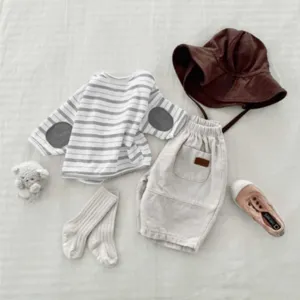 Toddler kids spring autumn clothing set detail, striped top with patches and casual shorts.