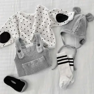 Adorable toddler baby autumn clothing set featuring polka dot top, knit overalls and bear hat.