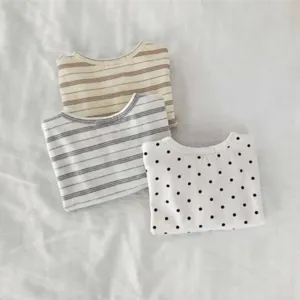 Detailed view of children long sleeve casual t-shirts featuring classic stripes and cute polka dots.