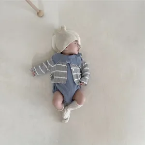 Infant baby knit striped cardigan detail, cute bunny ear hat, soft fabric cozy apparel.
