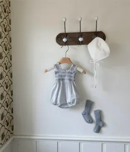 Cute baby girl summer smocked plaid romper set with cute bonnet and socks for daily wear.