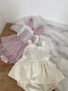Infant baby cotton romper detail, delicate lace ruffles and embroidered front panel design.