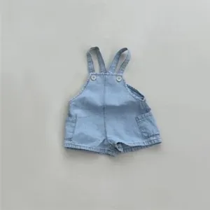 Detailed view of casual baby denim overall shorts featuring cute side pockets and straps.
