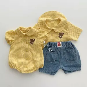 Infant summer checkered shirt and shorts set with cute bear embroidery for baby.
