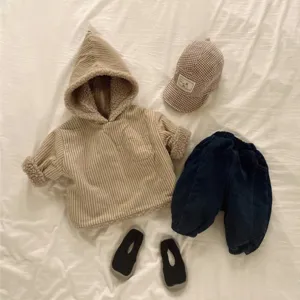 Detailed view of baby winter plush hooded cardigan outfit set with striped top and cute cap.