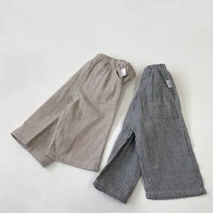 Detailed view of kids vintage striped casual pants, pure cotton fabric with large pockets.