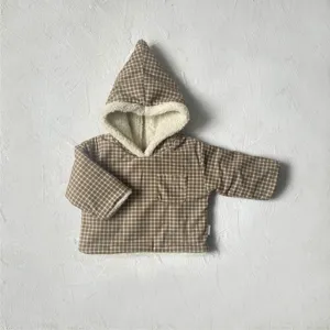Infant winter brown plaid hooded jacket detail showing soft white fleece lining and pocket.