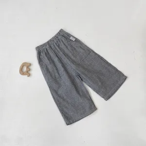 Children cotton striped casual pants detail view, vintage style with large pockets for kids.