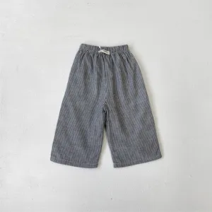 Children casual pants detail view, retro striped cotton fabric, elastic waistband design.