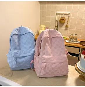 Casual checkered backpack for women, large capacity school bag in pink and blue colors.