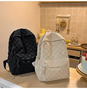Casual checkered backpack for women, large capacity minimalist school bag for daily use.