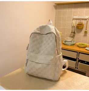 Detailed view of a minimalist beige checkered backpack, featuring large capacity and casual style.