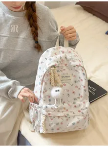 Japanese style fresh floral backpack for women, casual school bookbag with cute plush pendant.