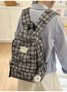 Japanese style plaid casual backpack with cute plush keychain, ideal for student daily commute.