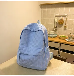 Casual light blue checkered backpack for women and students, large capacity versatile daily bag.