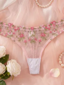 Pink floral embroidered mesh thong sheer lingerie panty elegant flat lay detail view