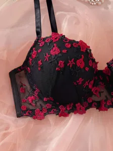 French style black bra with delicate red floral embroidery detail, elegant sheer mesh design.
