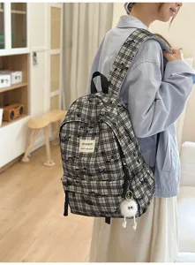 Japanese style plaid backpack for teen girls, cute casual school bookbag with plush pendant.