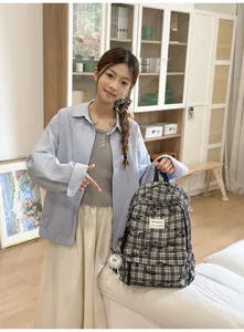 Japanese style plaid backpack for school and daily use, casual canvas book bag with cute pendant.