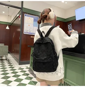 Casual black checkered backpack for women and students, large capacity stylish school bag.