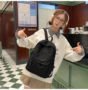 Casual checkered backpack for women and students, large capacity daily school bag.