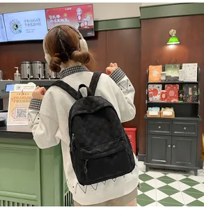 Casual black plaid checkered backpack for women, large capacity school bag for daily use.