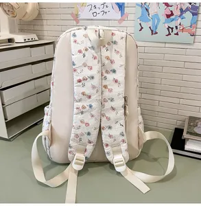 Floral pattern backpack detail, aesthetic student school bag strap and zipper close-up view.