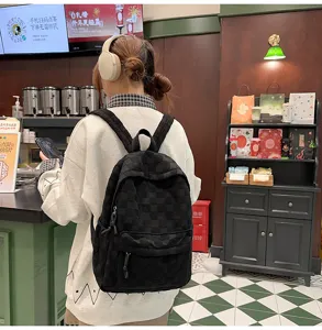 Classic black checkered backpack for daily use, spacious casual school bag for women.