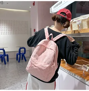 Pink woven grid casual backpack for women and students, stylish large capacity school bag.