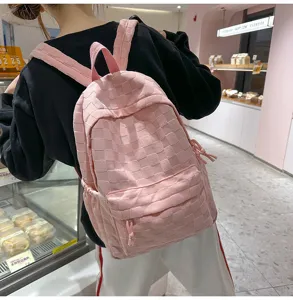 Stylish pink grid backpack for women and students, casual large capacity school bag with straps.