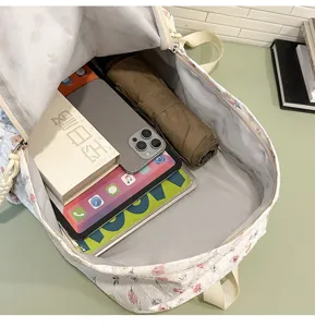 Japanese floral canvas backpack interior detail view, spacious storage for student daily use.