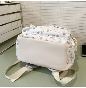 Floral print school backpack for teens and students, casual cute daily daypack with straps.