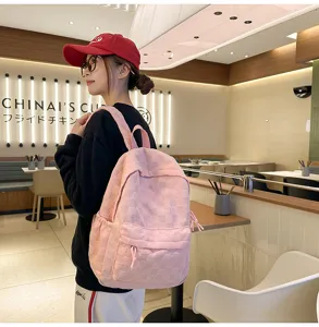 Pink plaid school backpack for women, large capacity casual daily daypack with simple cute style.